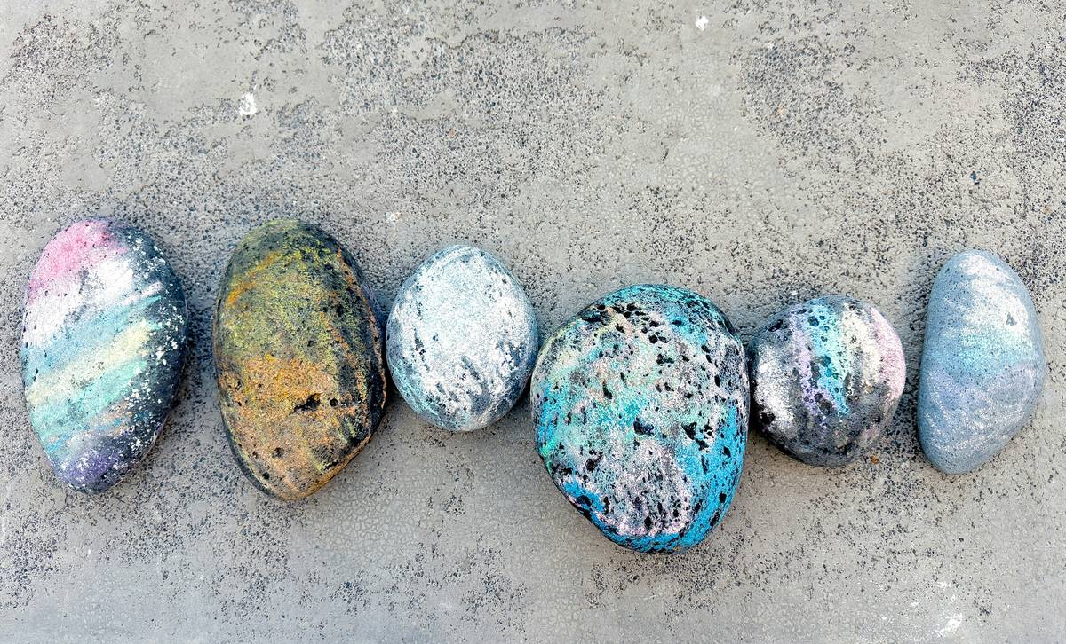 diy project rock painting design how showing three stages: raw stone, pencil-drawn floral outline, and finished acrylic-painted rock with glossy sealant